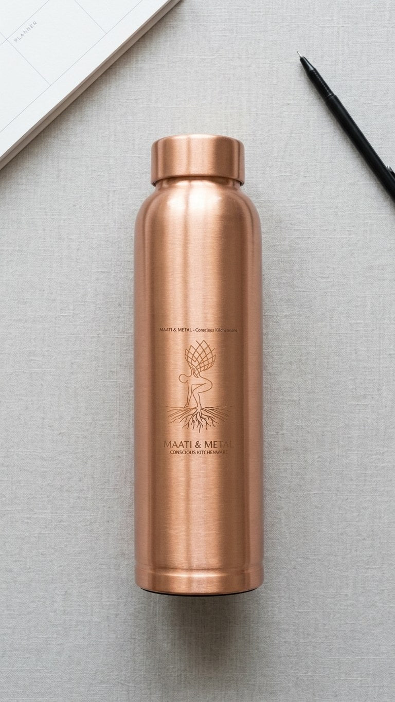 Pure Copper Bottle 1 Litre — flat lay with planner